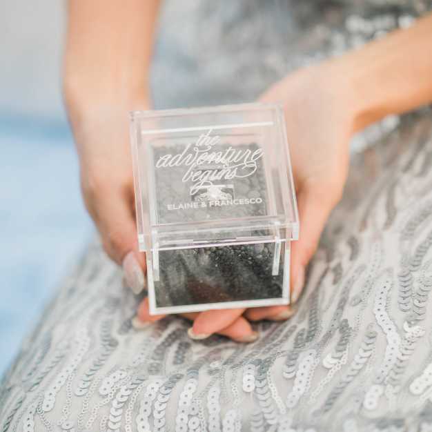 inspiration - bride holding a clear acrylic ring box